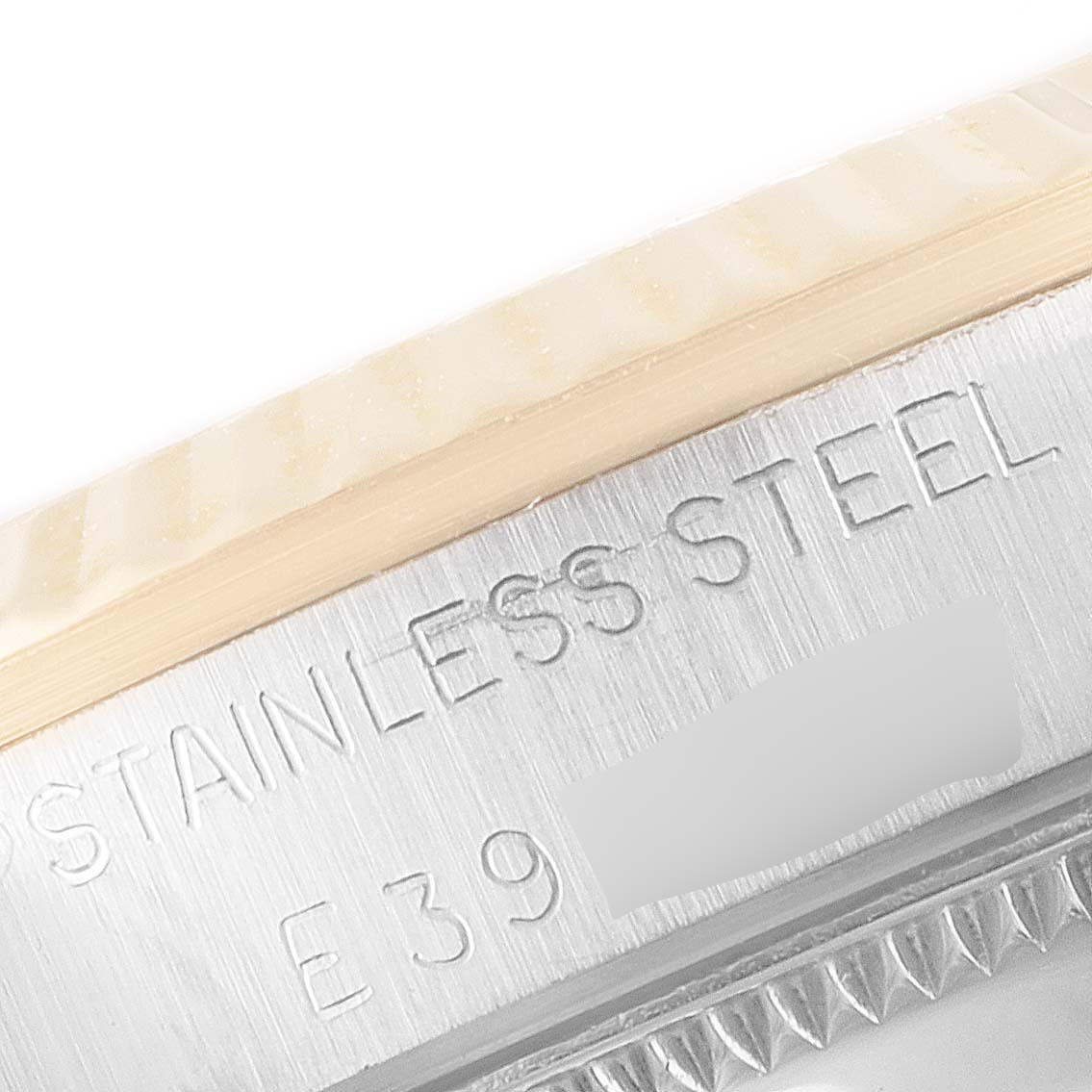 This close-up angle of the Rolex Mid-Size 68273 Women's Steel and Gold (two tone) Champagne Dial 68273 Women's Steel and Gold (two tone) Champagne Dial watch shows part of the stainless steel case and border.