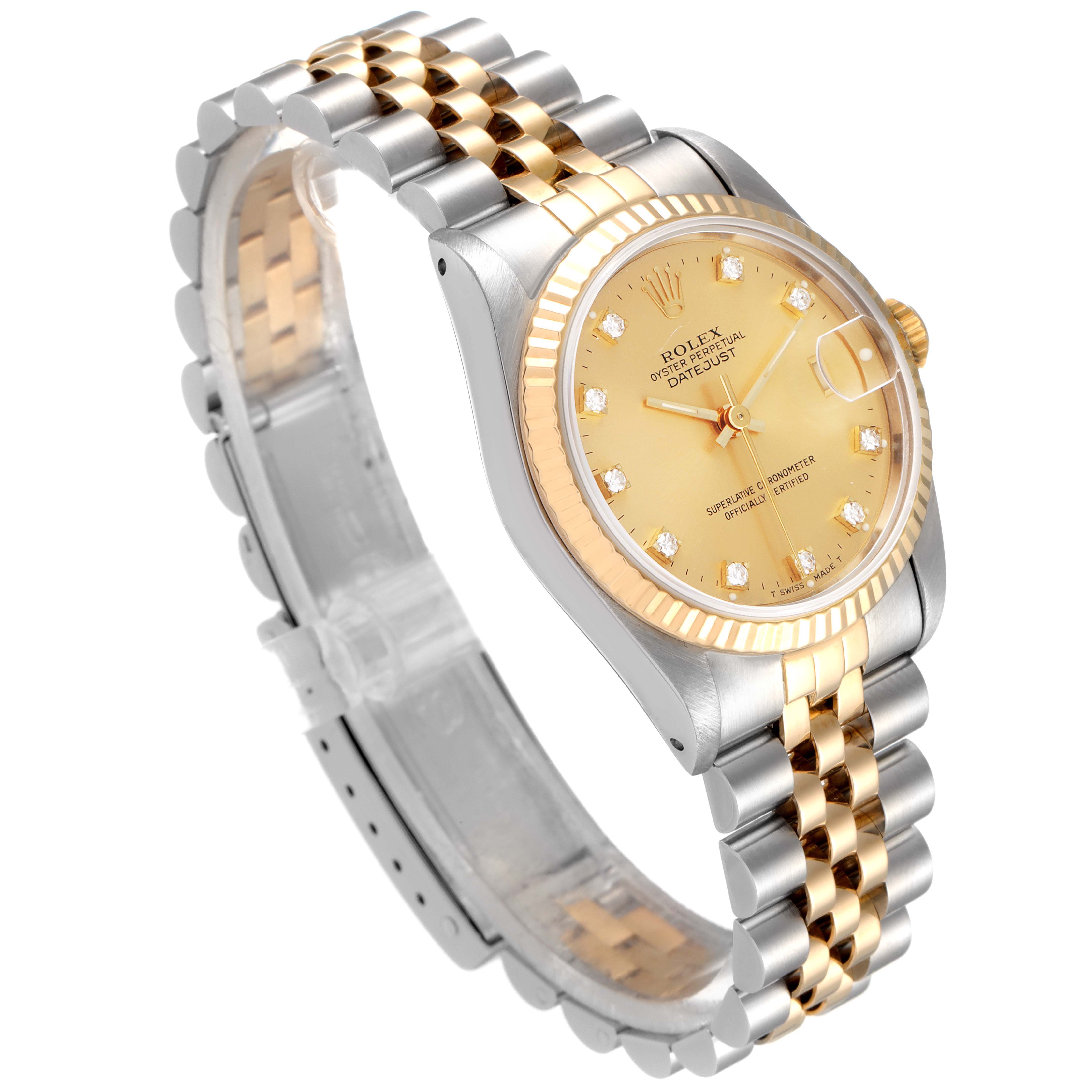 This image shows a Rolex Mid-Size 68273 Women's Steel and Gold (two tone) Champagne Dial 68273 Women's Steel and Gold (two tone) Champagne Dial Datejust watch from an angled side view displaying the gold and silver bracelet and dial.