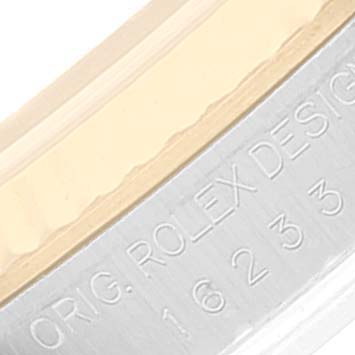 Close-up of the side of a Rolex Datejust 16233 Men's Steel and Gold (two tone) Champagne Dial 16233 Men's Steel and Gold (two tone) Champagne Dial watch, showing part of the engraved text "ORIG. ROLEX DESIGN 16233."