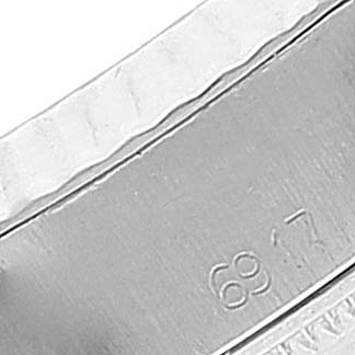 This close-up image shows a portion of the bracelet or clasp of a Rolex Date 6917 Women's Stainless Steel Silver Dial 6917 Women's Stainless Steel Silver Dial model watch, featuring the number "68."