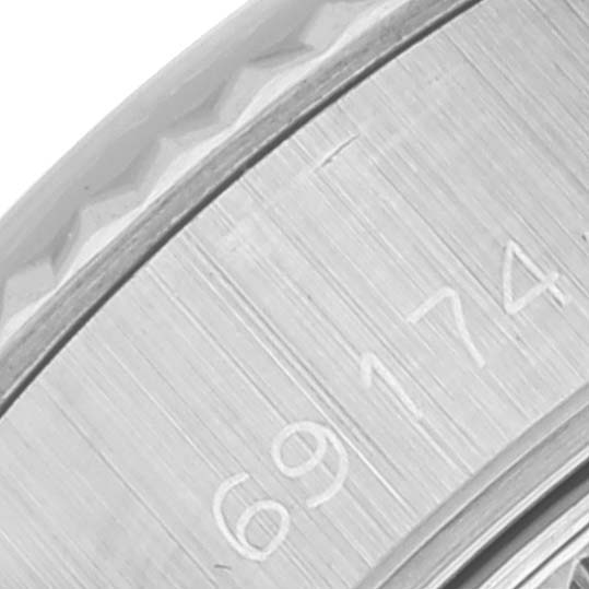 This image shows a close-up of the engraved side of the bezel of a Rolex Datejust 69174 Women's Stainless Steel Silver Dial 69174 Women's Stainless Steel Silver Dial watch, with part of the reference number visible.