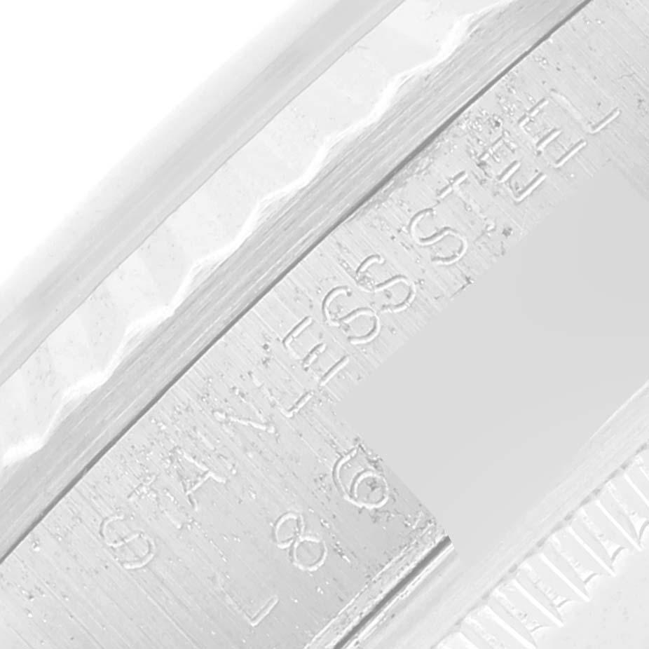 The image shows a close-up of the inner engraving on the bezel of a Rolex Datejust 16234 Men's Stainless Steel Silver Dial 16234 Men's Stainless Steel Silver Dial watch.
