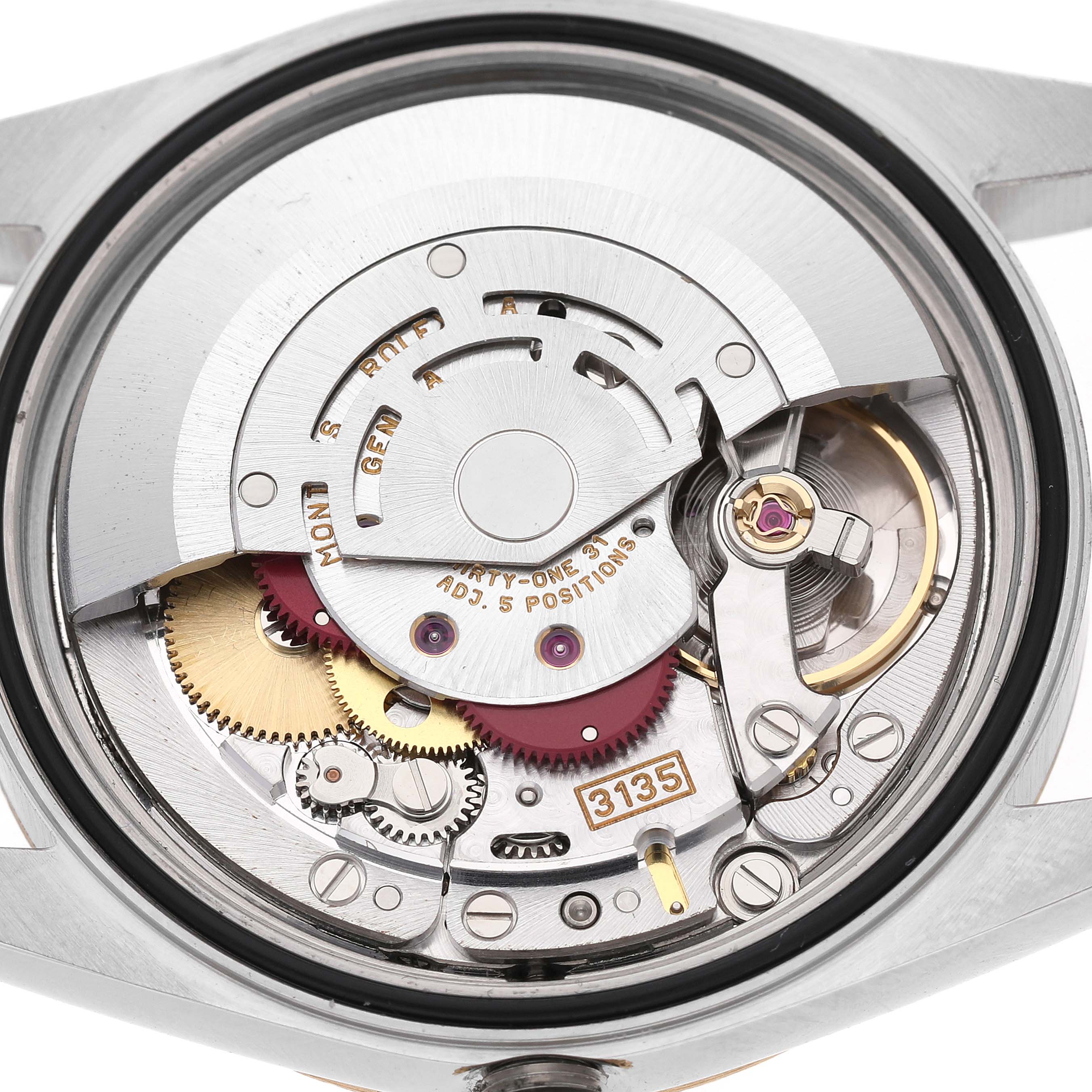 The image shows the movement mechanism of a Rolex Datejust 16233 Men's Stainless Steel Champagne Dial, highlighting gears, balance wheel, and screws from a rear angle.