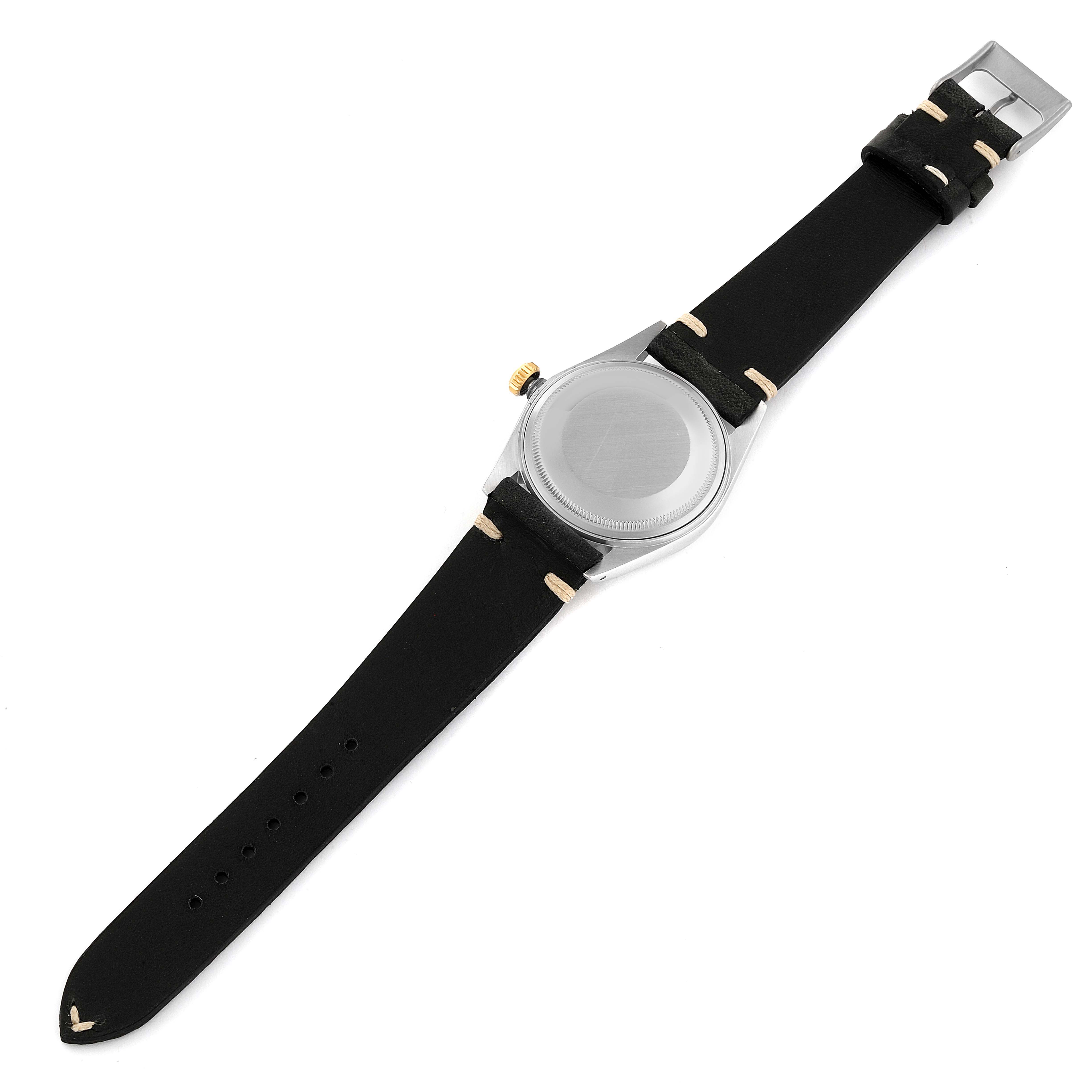 The image shows the back side and strap of a Rolex Vintage Collection 16013 Men's Steel and Gold (two tone) White Dial 16013 Men's Steel and Gold (two tone) White Dial model watch at an overhead angle.