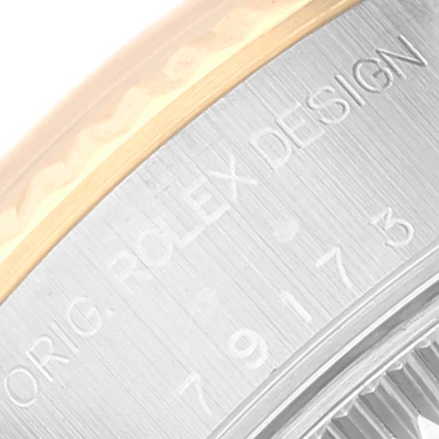 The image shows a close-up of the case back edge and model number of a Rolex Datejust 79173 Women's Steel and Gold (two tone) Champagne Dial 79173 Women's Steel and Gold (two tone) Champagne Dial.