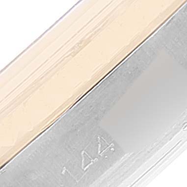 The image shows a close-up of the metallic edge and engravings on a Rolex Vintage Collection 1601 Men's Steel and Gold (two tone) Silver Dial 1601 Men's Steel and Gold (two tone) Silver Dial watch.