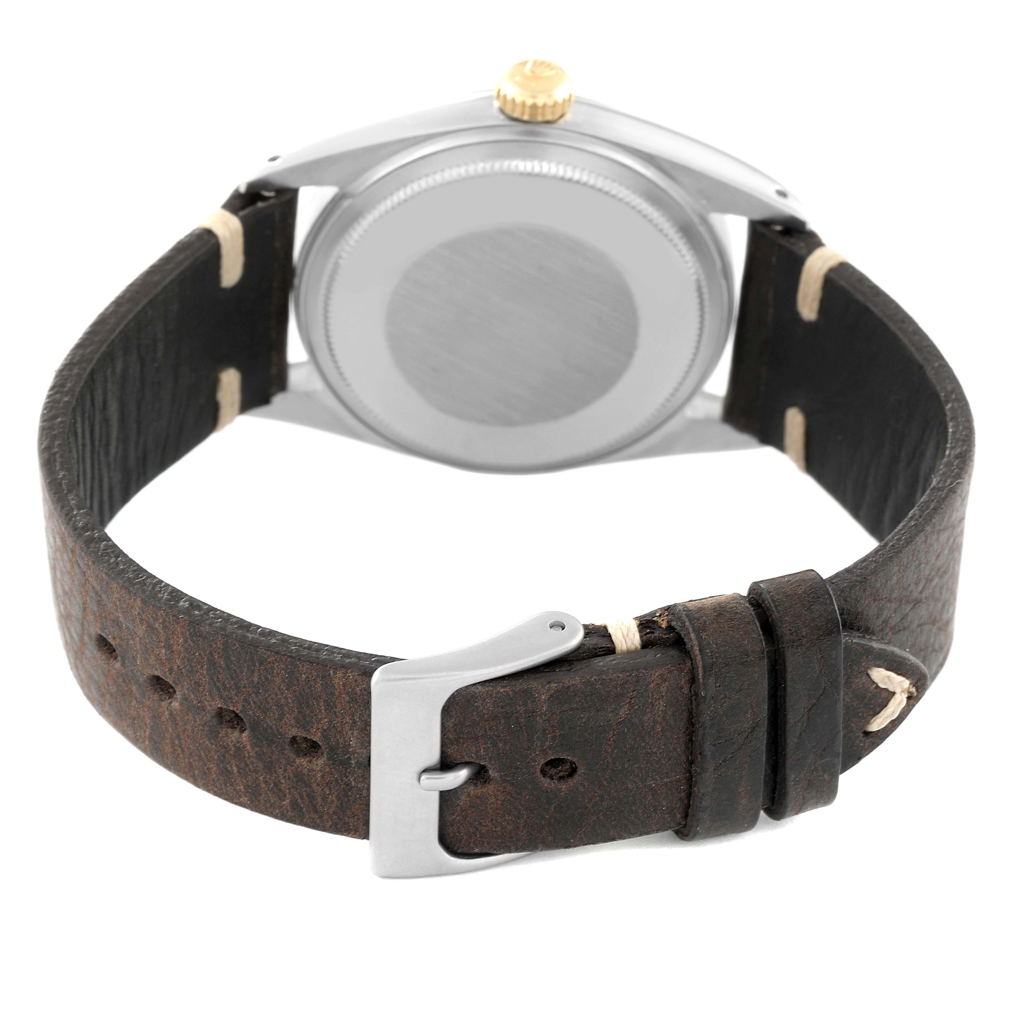 The image shows the back view of a Vintage Collection Rolex watch, highlighting its leather strap and buckle.