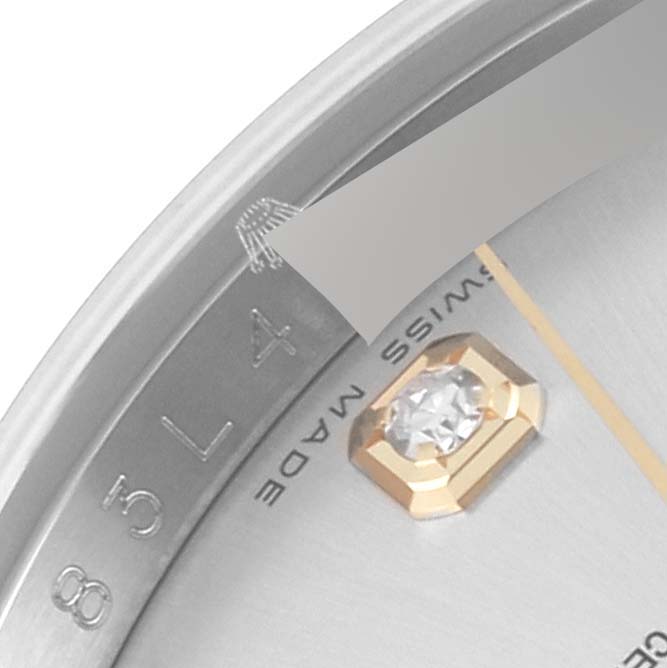 This close-up image shows the dial, bezel, and part of a diamond marker of a Rolex Datejust 116233 Men's Steel and Gold (two tone) Silver Dial 116233 Men's Steel and Gold (two tone) Silver Dial watch.