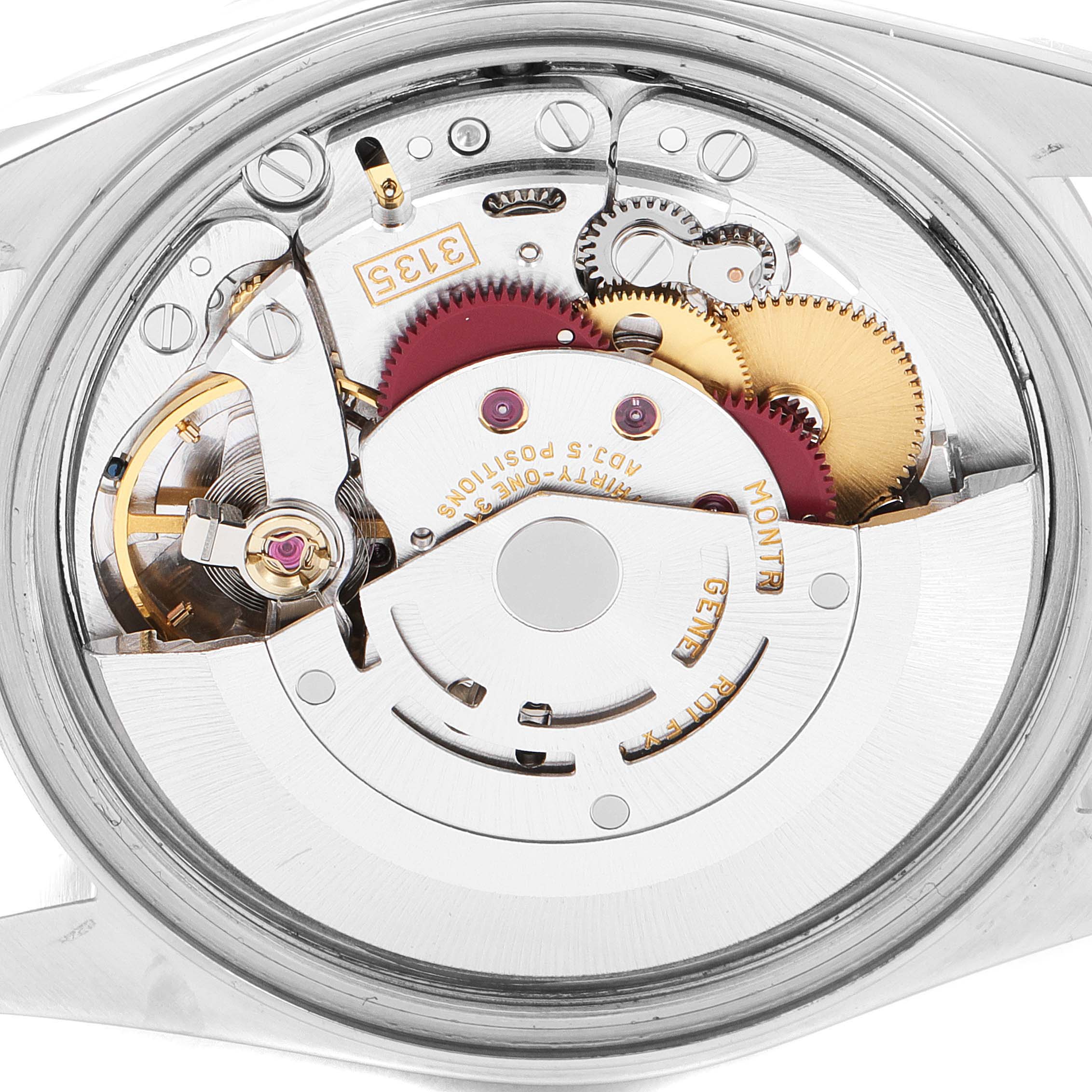 The image shows the movement and intricate inner workings of a Rolex Datejust 16233 Men's Steel and Gold (two tone) Champagne Dial 16233 Men's Steel and Gold (two tone) Champagne Dial watch from a rear angle.