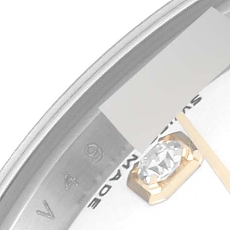 The image shows a close-up of the Rolex Datejust 179173 Women's Steel and Gold (two tone) White Dial 179173 Women's Steel and Gold (two tone) White Dial watch's dial, including a diamond marker and part of the bezel.