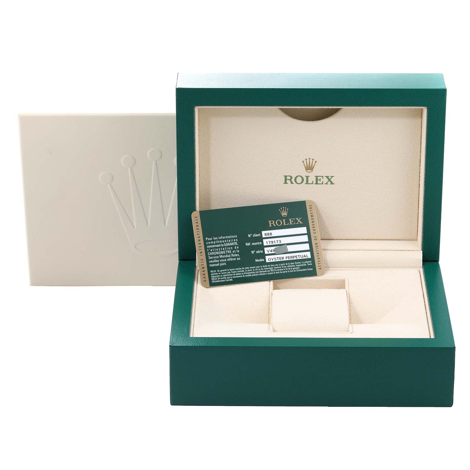 The image shows an open green Rolex Datejust 179173 Women's Steel and Gold (two tone) White Dial 179173 Women's Steel and Gold (two tone) White Dial watch box with its authenticity card inside and a soft beige interior.