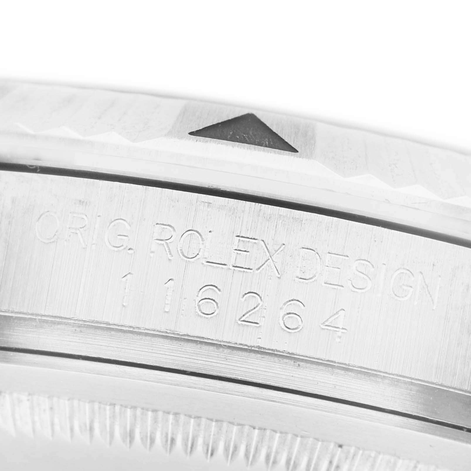 The image shows a close-up of the case side of a Rolex Turn-o-Graph 116264 Men's Stainless Steel Blue Dial, highlighting the engraved design number.