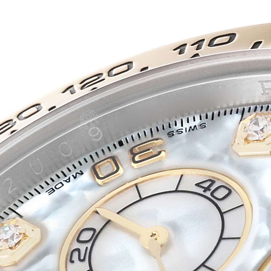 This close-up image shows a partial view of the dial and bezel of a Rolex Daytona 116503 Men's Steel and Gold (two tone) Mother of Pearl Dial 116503 Men's Steel and Gold (two tone) Mother of Pearl Dial watch.