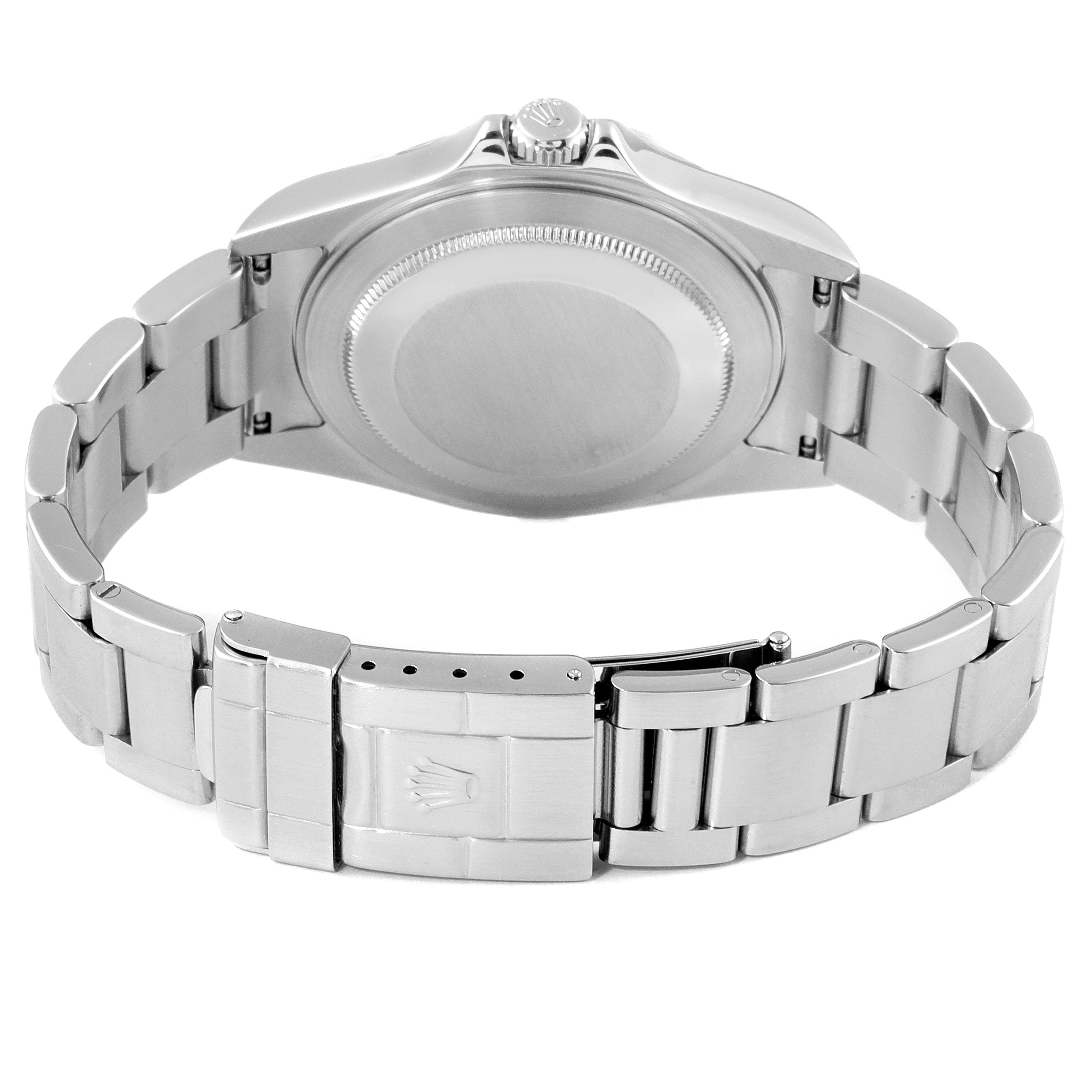 The image shows the back of a Rolex Explorer 16570 Men's Stainless Steel White Dial 16570 Men's Stainless Steel White Dial's case and bracelet, focusing on the clasp and screw-down case back.