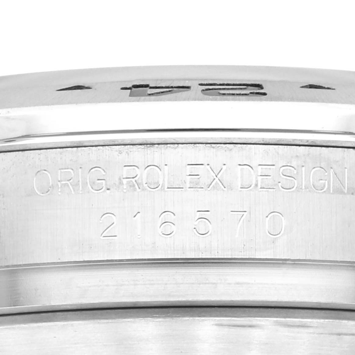 The image shows a close-up of the side of a Rolex Explorer 216570 Men
s Stainless Steel White Dial 216570 Men
s Stainless Steel White Dial watch, featuring the model number 216570 and "ORIG. ROLEX DESIGN" engraving.