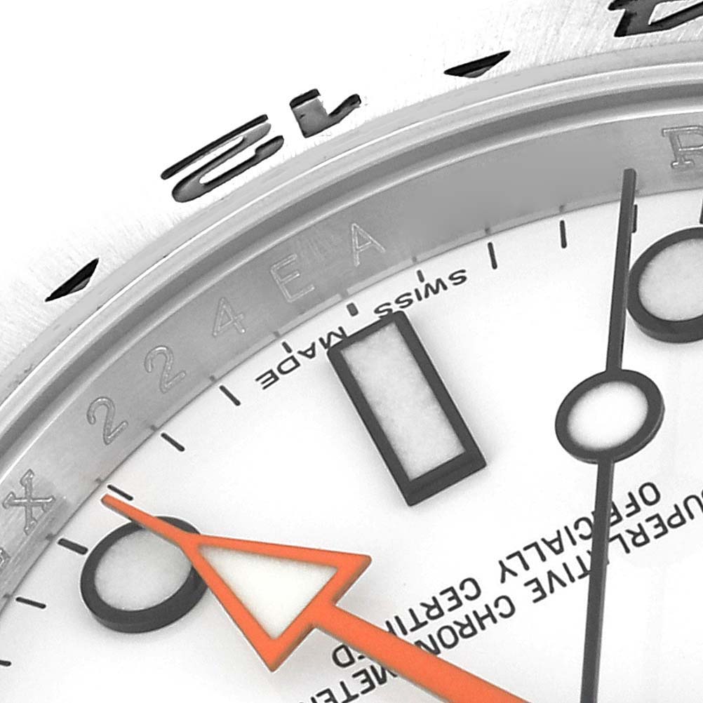 This close-up image shows the dial, hands, and a portion of the bezel of the Rolex Explorer 216570 Men
s Stainless Steel White Dial 216570 Men
s Stainless Steel White Dial watch model.