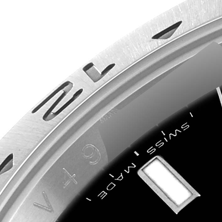 This close-up image shows the bezel, partial dial, and "Swiss Made" text of a Rolex Explorer 16570T Men
s Stainless Steel Black Dial 16570T Men
s Stainless Steel Black Dial watch.