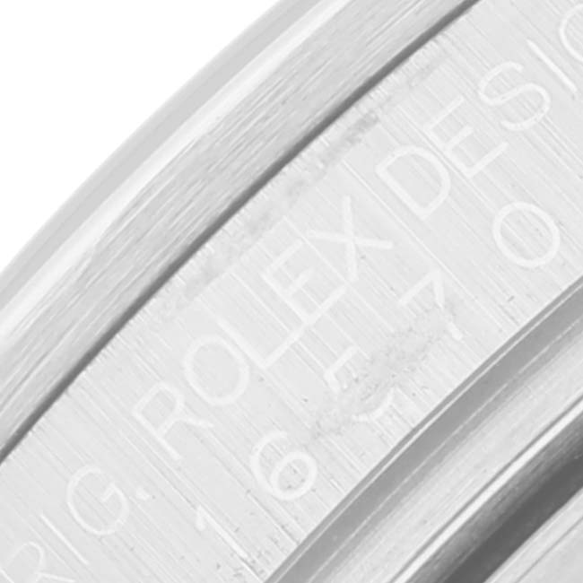 This image shows a close-up of the engraved side of the bezel of a Rolex Explorer 16570T Men
s Stainless Steel Black Dial 16570T Men
s Stainless Steel Black Dial watch.