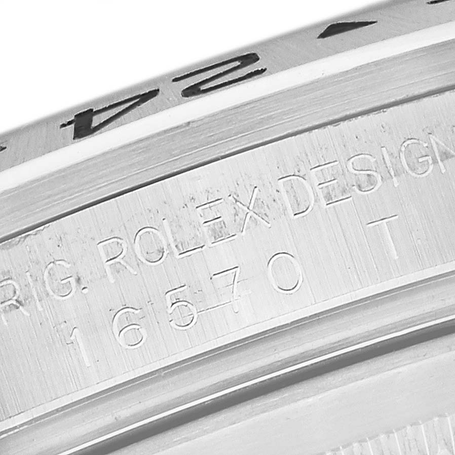 The image shows a macro close-up of the bezel and engraved side of a Rolex Explorer 16570 Men's Stainless Steel Black Dial 16570 Men's Stainless Steel Black Dial watch.