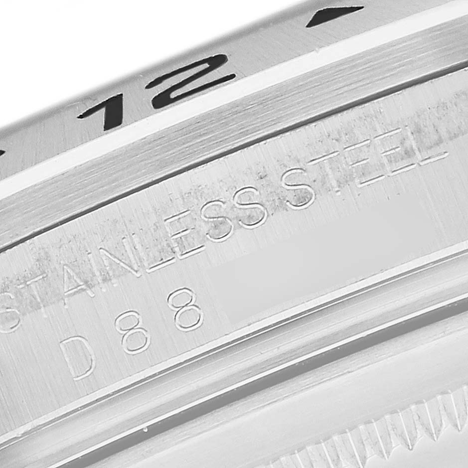 This close-up image shows the bezel and stainless steel engraving on the Rolex Explorer 16570 Men's Stainless Steel Black Dial 16570 Men's Stainless Steel Black Dial watch.