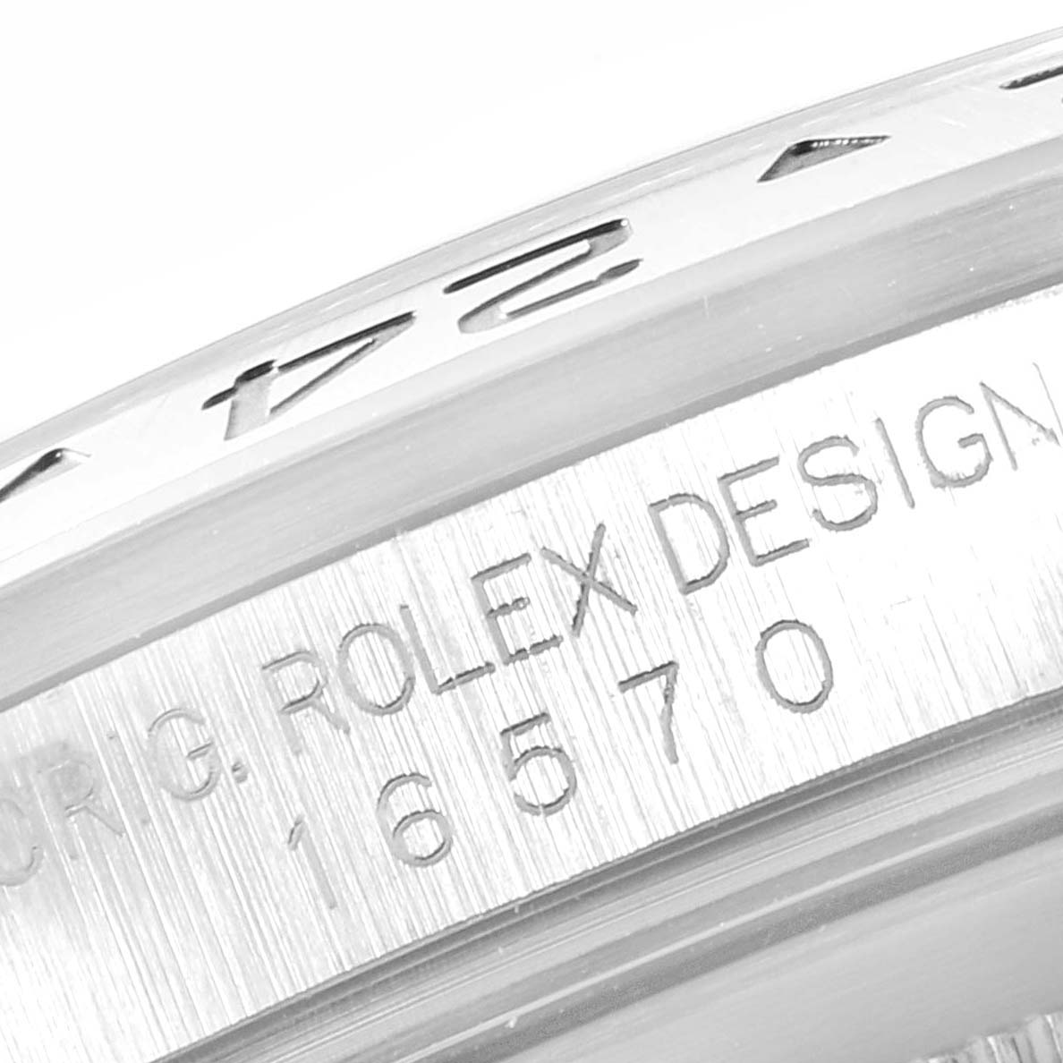 This image shows a close-up of the case side and bezel of a Rolex Explorer 16570 Men
s Stainless Steel White Dial 16570 Men
s Stainless Steel White Dial model, highlighting the engraved text and design details.