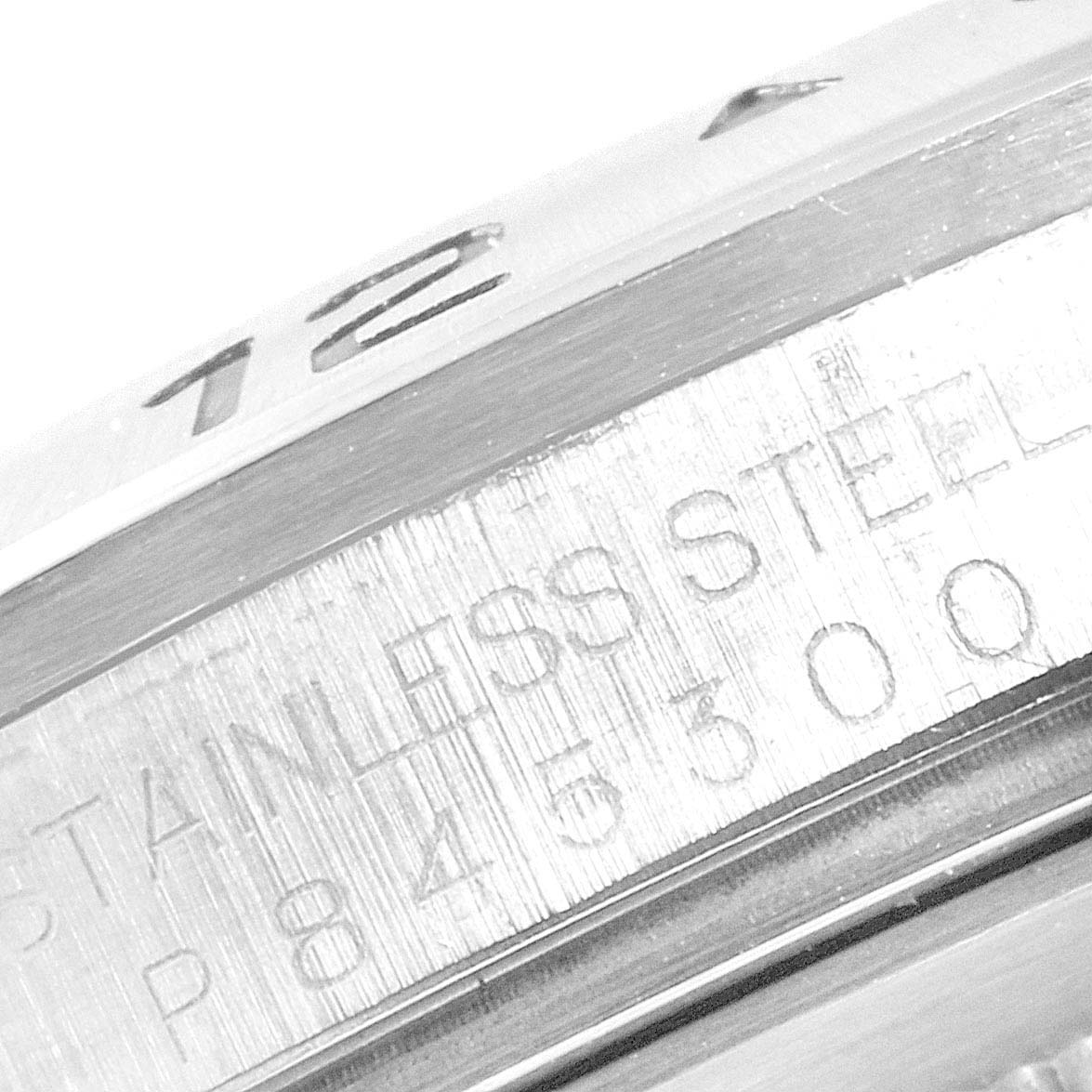 This close-up image shows the engraved bezel and case of a Rolex Explorer 16570 Men
s Stainless Steel White Dial 16570 Men
s Stainless Steel White Dial watch.