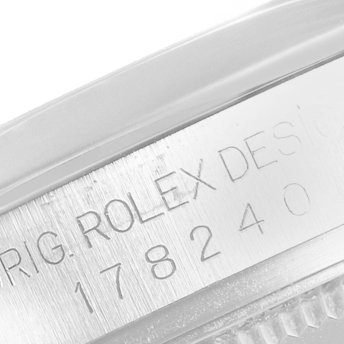 The image shows a close-up of the serial number engraving on the side of a Rolex Mid-Size 178240 Women
s Stainless Steel Silver Dial 178240 Women
s Stainless Steel Silver Dial watch case.