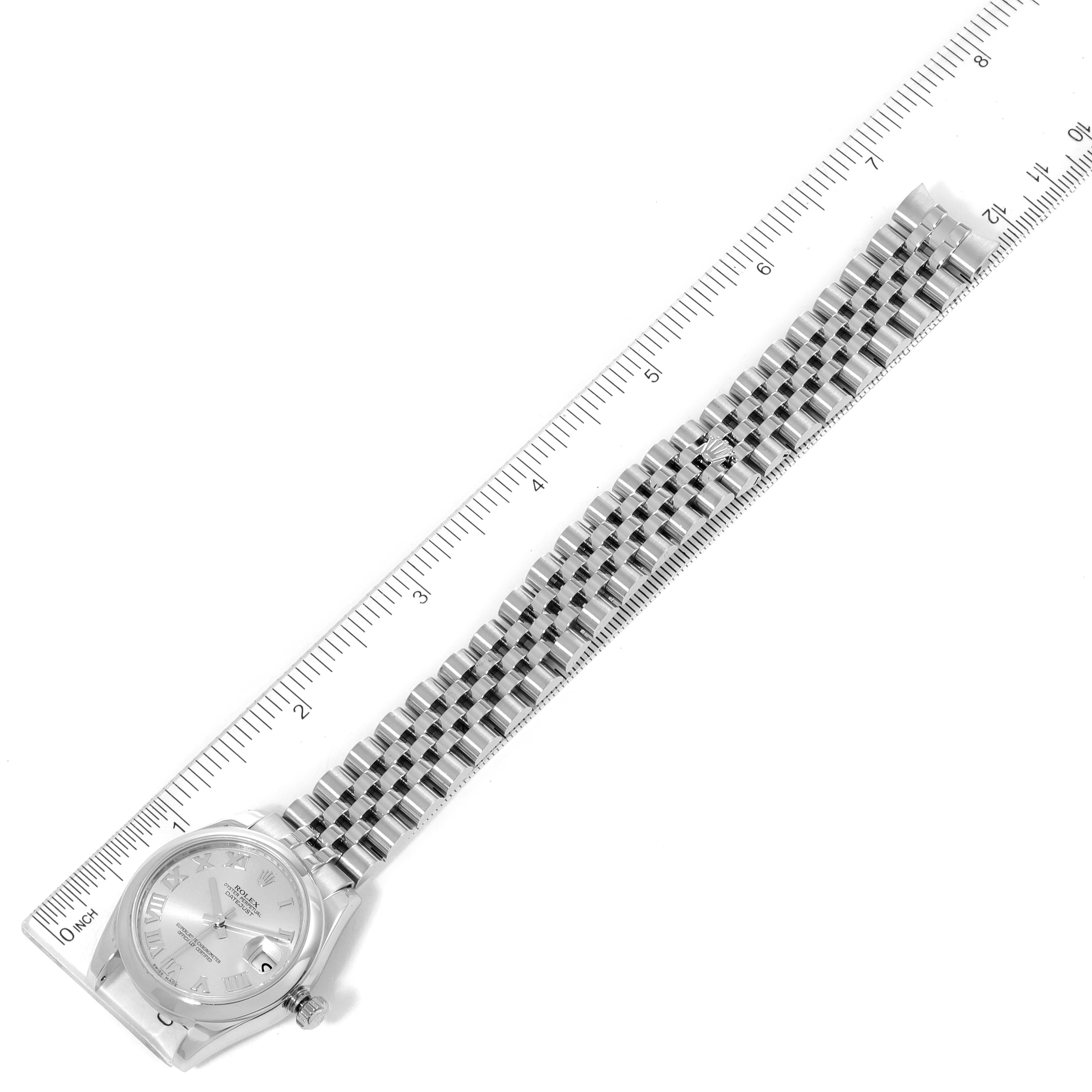 The image shows a top-down view of a Rolex Mid-Size 178240 Women
s Stainless Steel Silver Dial 178240 Women
s Stainless Steel Silver Dial watch with its face and bracelet, measured beside a ruler.