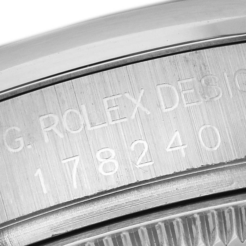 Close-up view of the side of a Rolex Mid-Size 178240 Women's Stainless Steel Pink Dial 178240 Women's Stainless Steel Pink Dial model watch, focusing on the engraved model number and "ROLEX" branding.