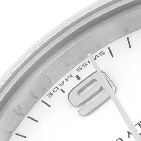 The image shows a close-up of the dial's edge and markings, including the "Swiss Made" label, of a Mid-Size Rolex watch.