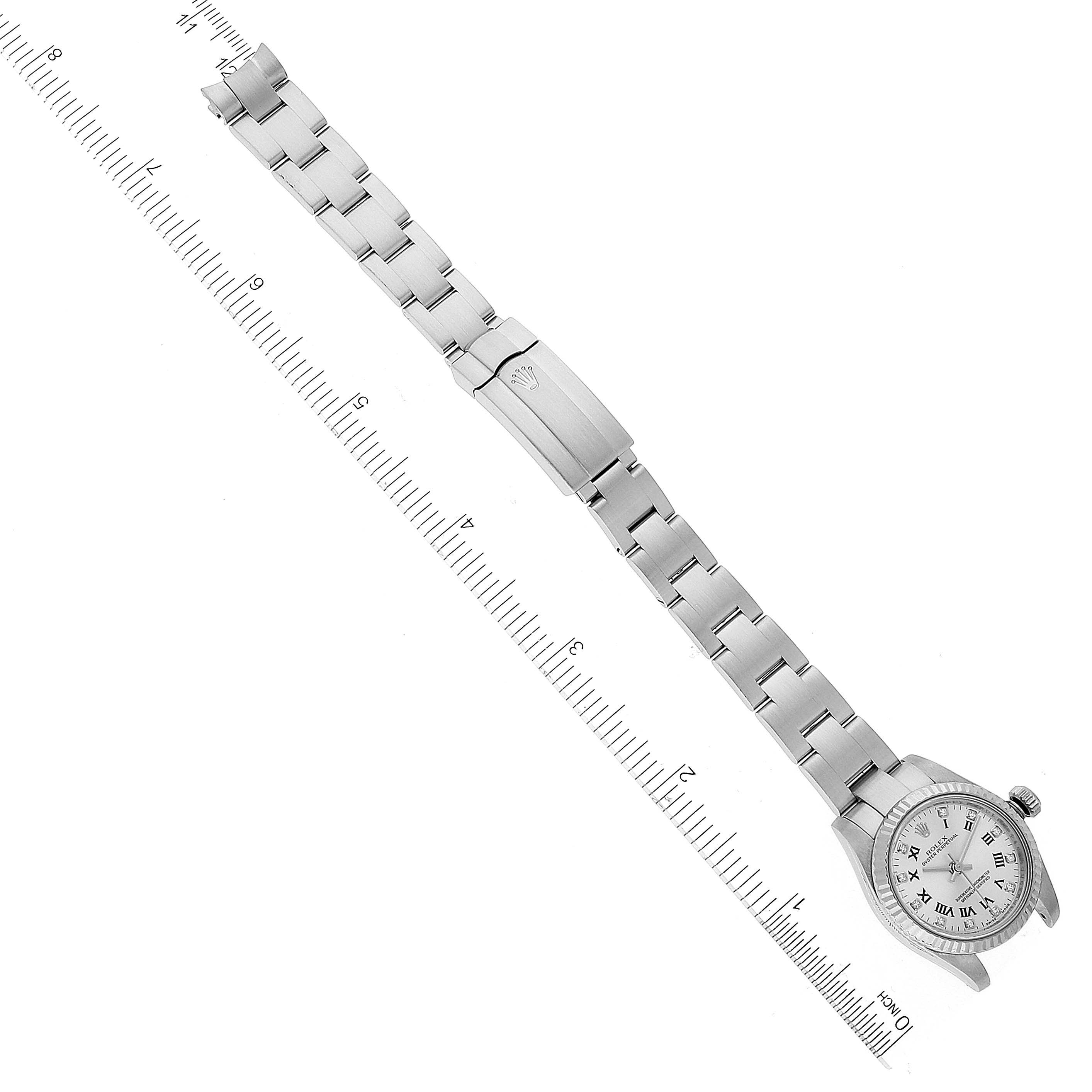 The image shows a Rolex Oyster Perpetual 176234 Women's Stainless Steel Silver Dial 176234 Women's Stainless Steel Silver Dial watch laid flat with its clasp, buckle, and a scale for measurement.