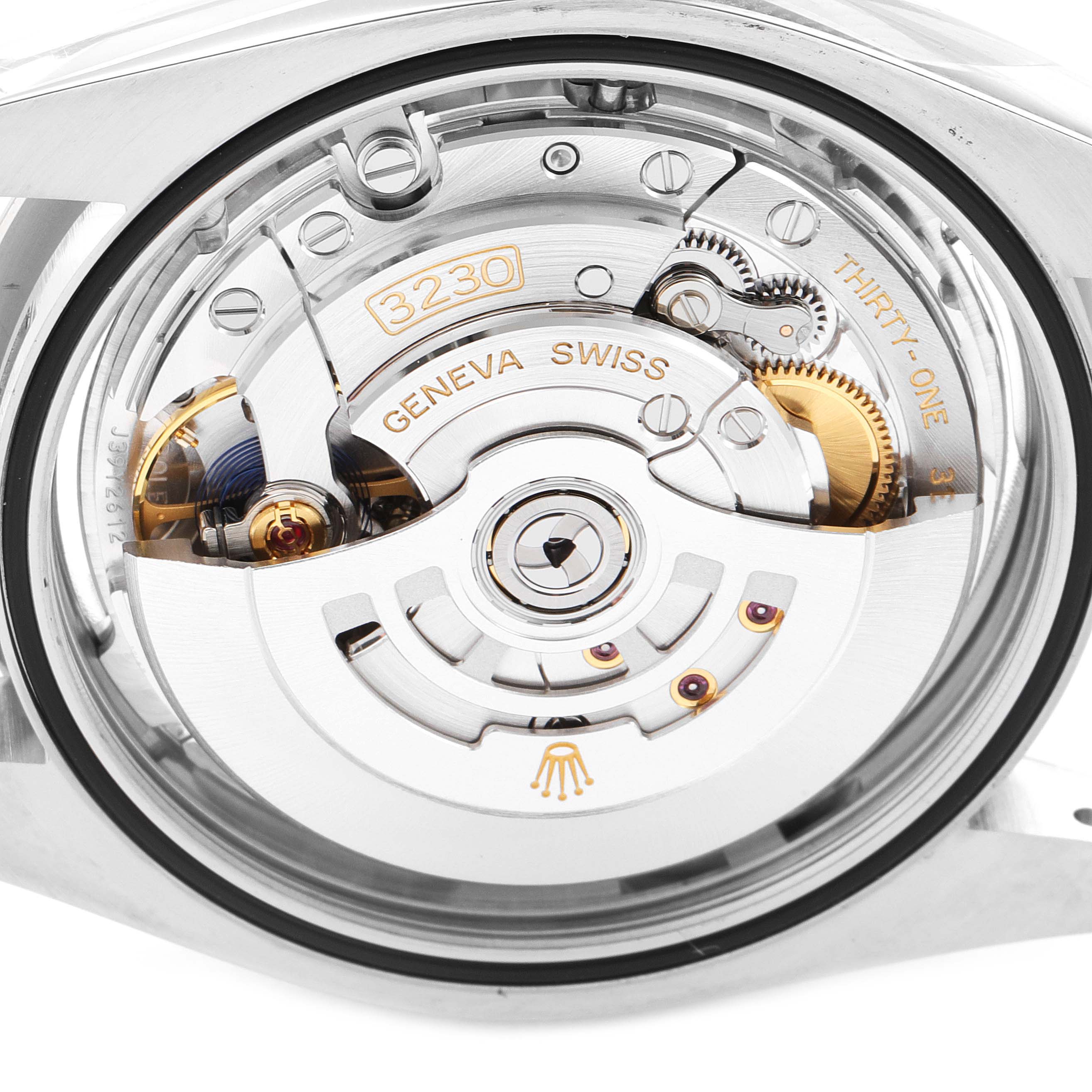 The image shows the back view of the Rolex Oyster Perpetual 124300 Men's Stainless Steel Silver Dial 124300 Men's Stainless Steel Silver Dial watch, highlighting its internal mechanical movement.