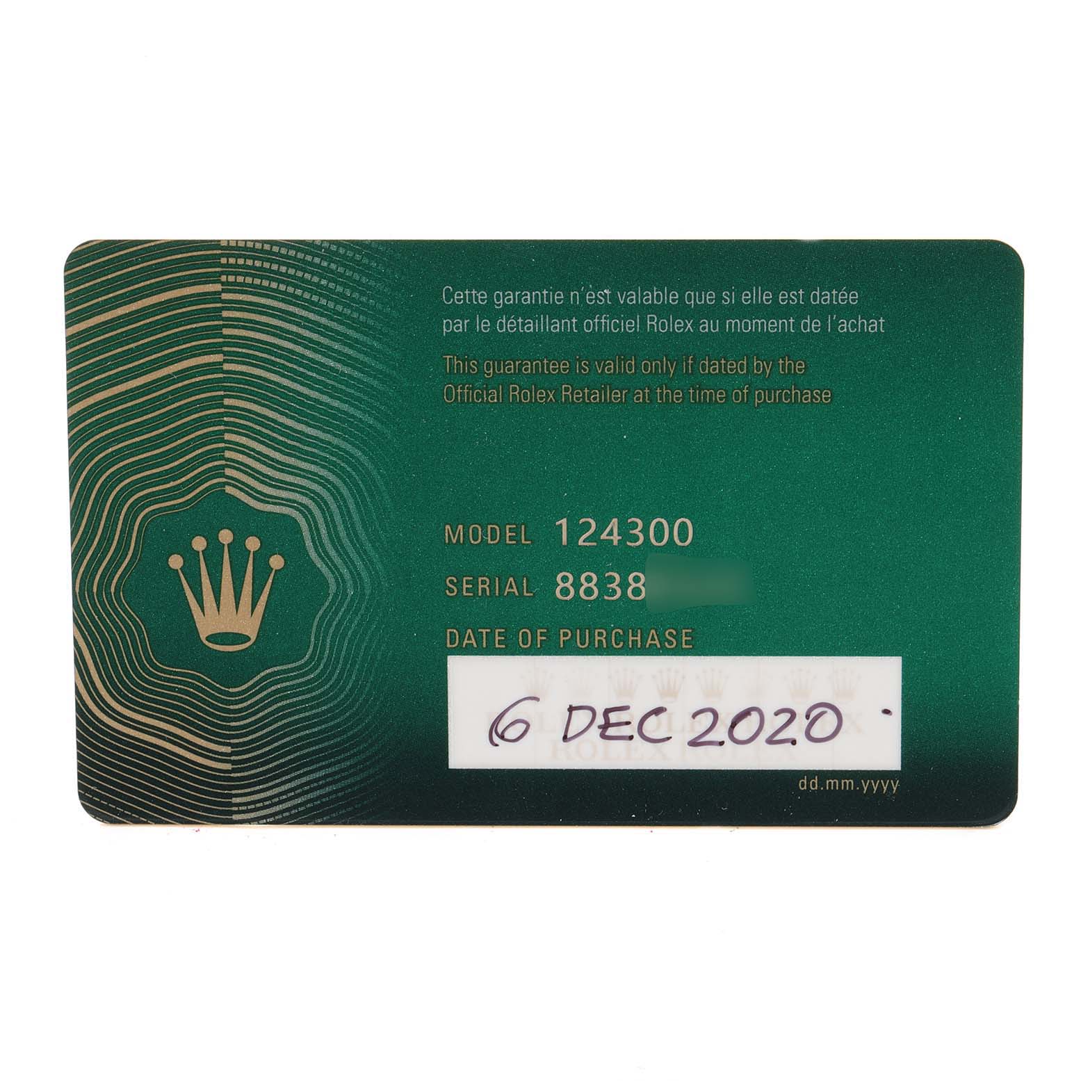 This image shows the warranty card for a Rolex Oyster Perpetual 124300 Men's Stainless Steel Silver Dial 124300 Men's Stainless Steel Silver Dial model 124300, including its purchase date and serial number.