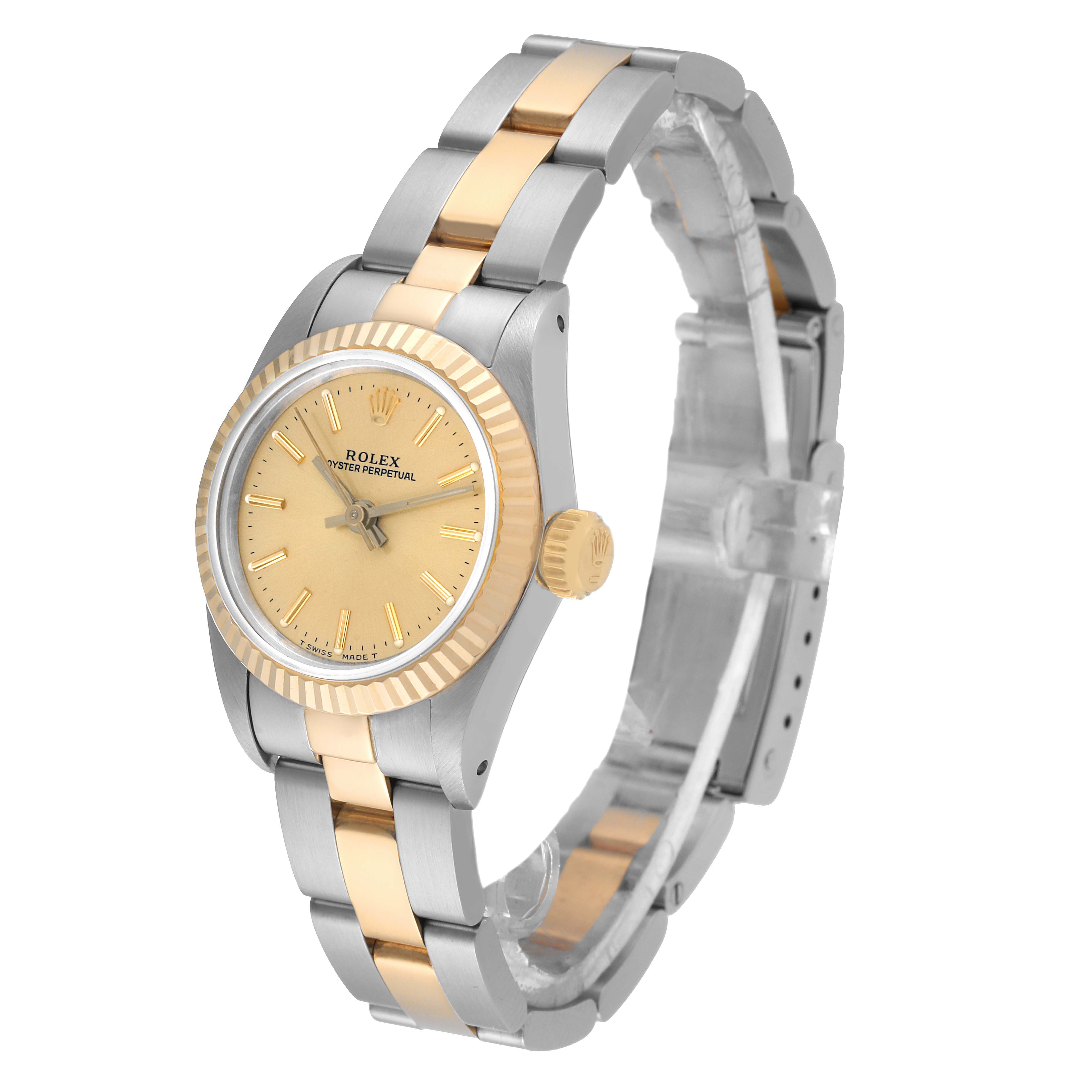 The Rolex Oyster Perpetual 67193 Women
s Steel and Gold (two tone) Champagne Dial 67193 Women
s Steel and Gold (two tone) Champagne Dial watch is shown at a front angle, displaying its dial, bezel, and two-tone bracelet.