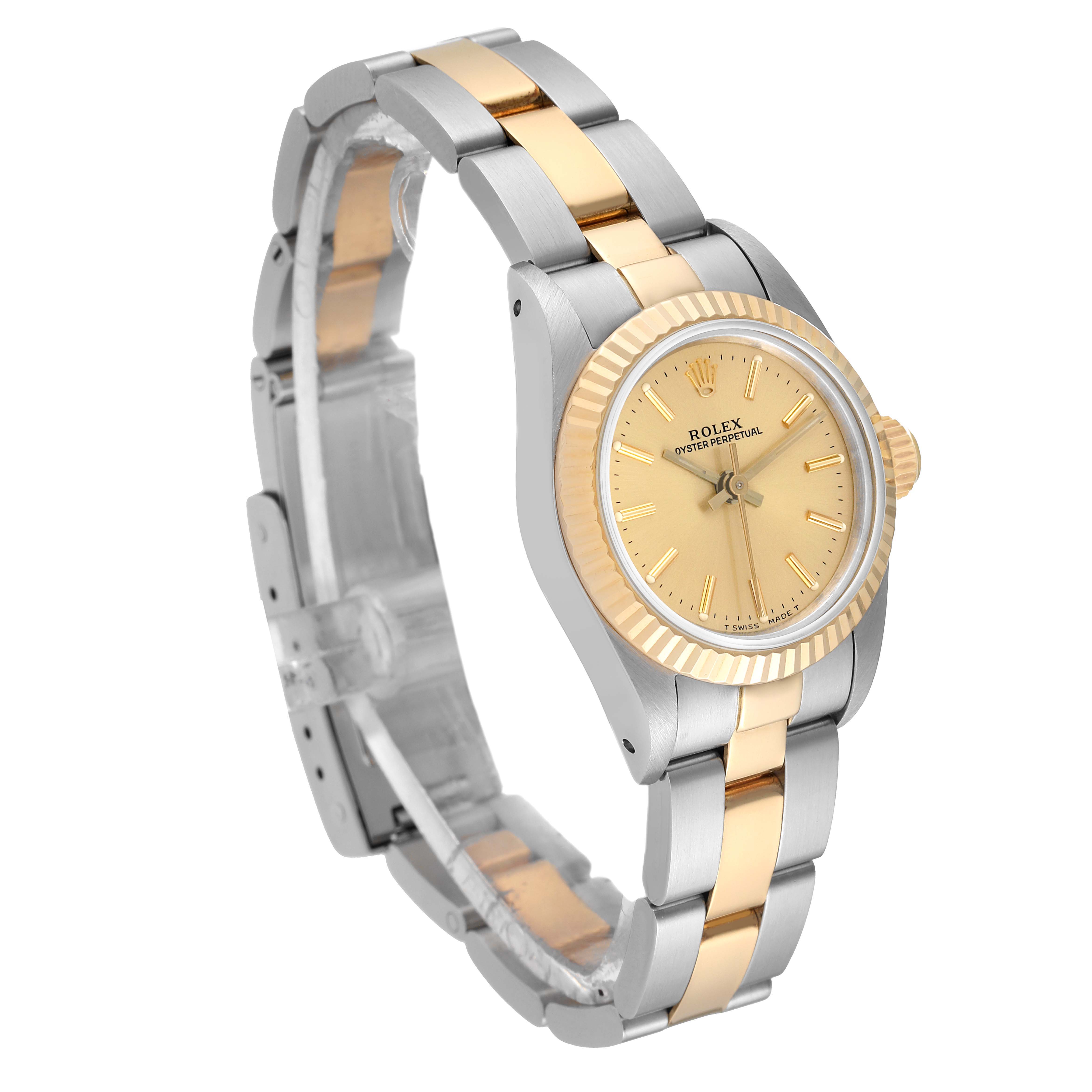This image shows a side and angled view of a Rolex Oyster Perpetual 67193 Women
s Steel and Gold (two tone) Champagne Dial 67193 Women
s Steel and Gold (two tone) Champagne Dial watch, highlighting its gold and silver bracelet and dial.