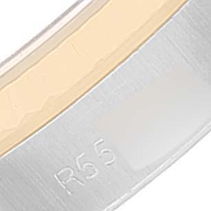 This image shows a close-up of the inside of the bezel or ring of a Rolex Oyster Perpetual 67193 Women
s Steel and Gold (two tone) Champagne Dial 67193 Women
s Steel and Gold (two tone) Champagne Dial watch, highlighting the engraved marking "R55."