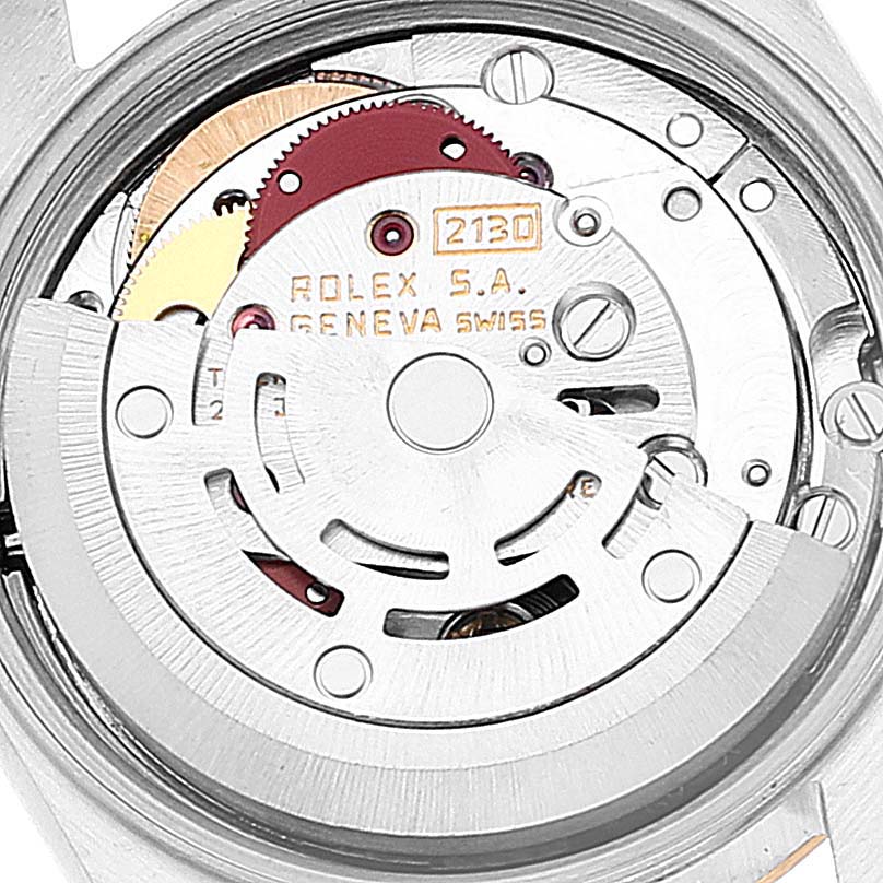 This image shows the movement mechanism of a Rolex Oyster Perpetual 67193 Women
s Steel and Gold (two tone) Champagne Dial 67193 Women
s Steel and Gold (two tone) Champagne Dial watch from a close-up rear angle.