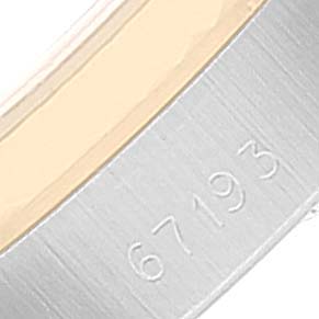 This image shows a close-up of the case back of a Rolex Oyster Perpetual 67193 Women
s Steel and Gold (two tone) Champagne Dial 67193 Women
s Steel and Gold (two tone) Champagne Dial watch, focusing on the model number 67193.