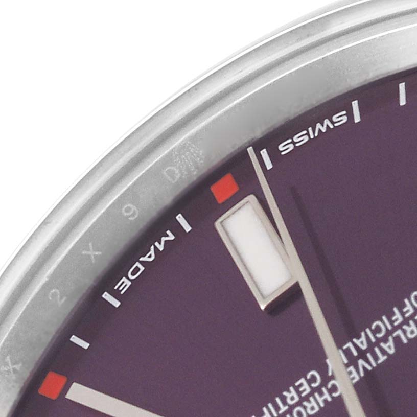 This image shows a close-up of the dial and bezel of the Rolex Oyster Perpetual 114300 Men's Stainless Steel Burgundy Dial 114300 Men's Stainless Steel Burgundy Dial watch.
