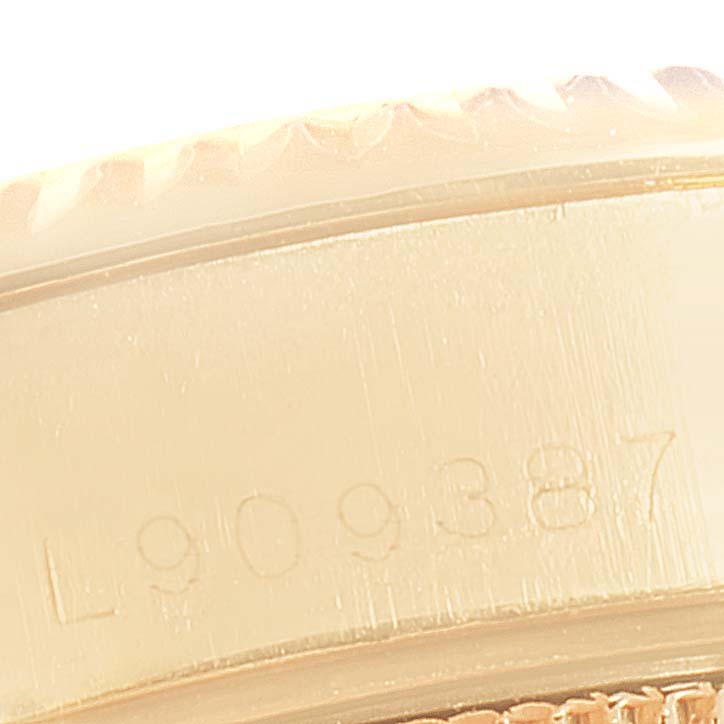 The image shows a close-up of the serial number and the edge of the bezel of a Rolex President 79188 Women
s Yellow Gold Mother of Pearl Dial 79188 Women
s Yellow Gold Mother of Pearl Dial model.