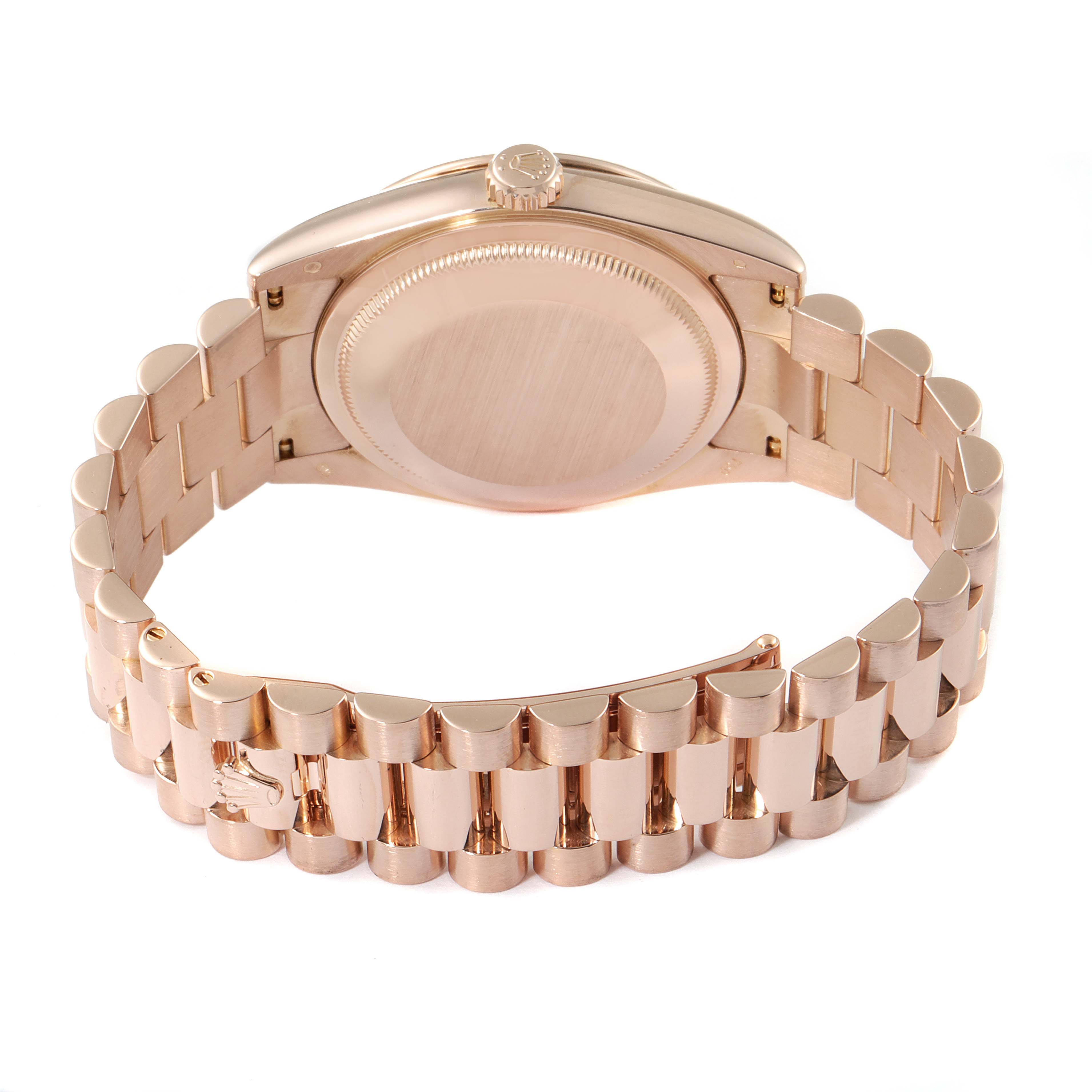 The image shows the back and bracelet of a Rolex President 118235 Men's Rose Gold Pink Dial 118235 Men's Rose Gold Pink Dial model watch at a slightly elevated angle.