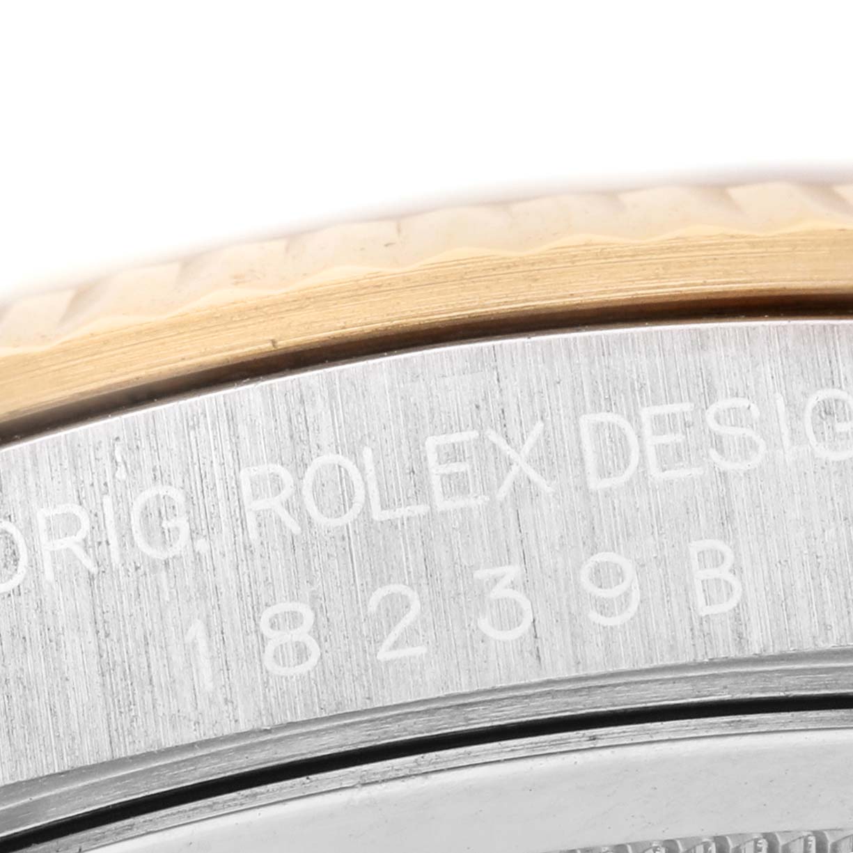 The image shows a close-up of the engraved side of a Rolex President 18239 Men's White Gold Silver Dial model, with part of the bezel and case visible.