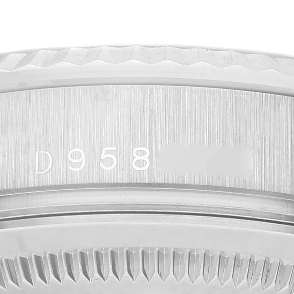 This is a close-up view of the serial number on the case side of a Rolex President 118239 Men's White Gold Silver Dial 118239 Men's White Gold Silver Dial model.