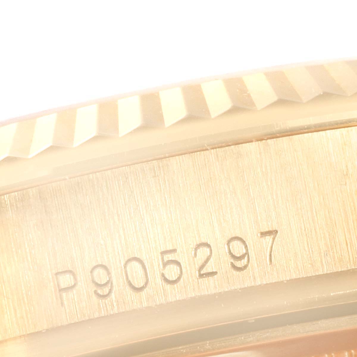 This image shows a close-up of the serial number engraved on the case of a Rolex President 118338 Men
s Yellow Gold Champagne Dial 118338 Men
s Yellow Gold Champagne Dial model.