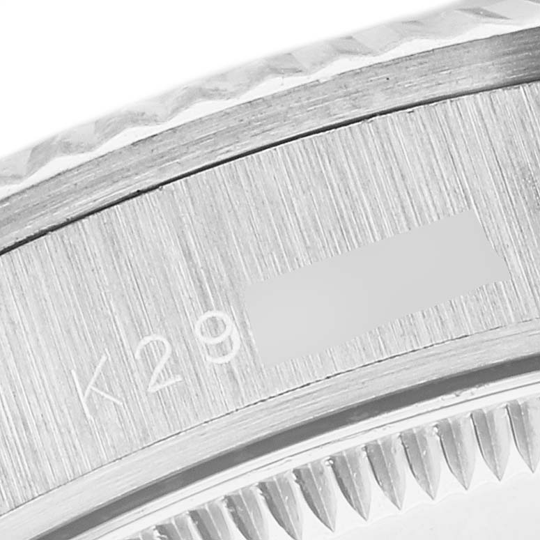 This image shows a close-up of the bezel and part of the case edge of a Rolex President 78279 Women's White Gold Silver Dial 78279 Women's White Gold Silver Dial model watch.