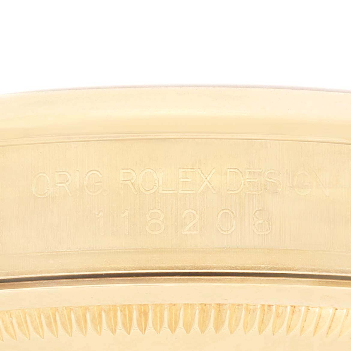 The image shows a close-up of the President model by Rolex, highlighting the engraved "Orig. Rolex Design 118208" on the case.