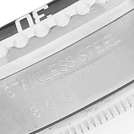 The image shows a close-up of the stainless steel bezel and part of the engravings on the Rolex Vintage Collection 1665 Men's Stainless Steel Black Dial 1665 Men's Stainless Steel Black Dial watch.