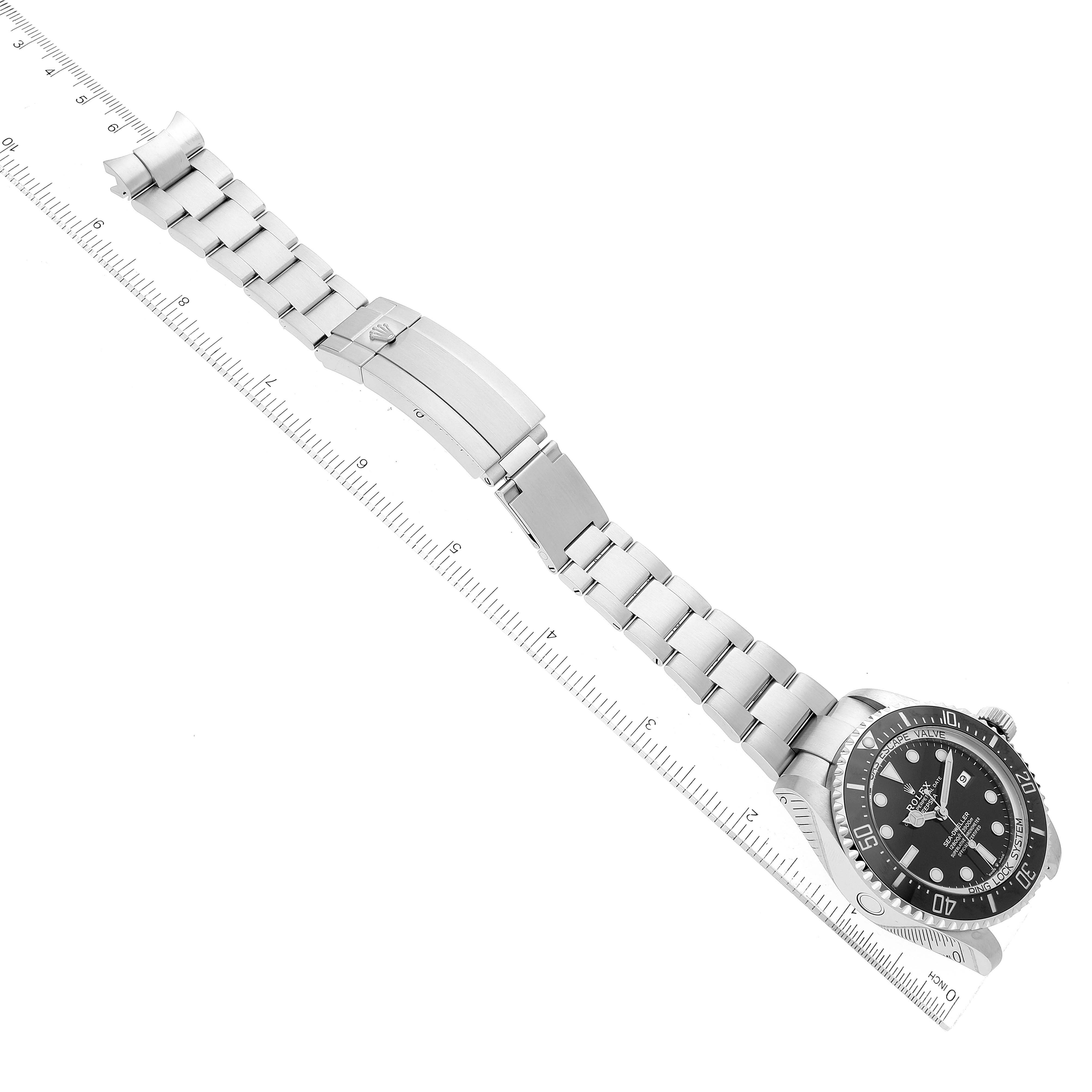 The image shows a Rolex Sea-Dweller 126660 Men
s Stainless Steel Black Dial 126660 Men
s Stainless Steel Black Dial watch laid flat, displaying the face, bezel, and full metal strap with deployment clasp.