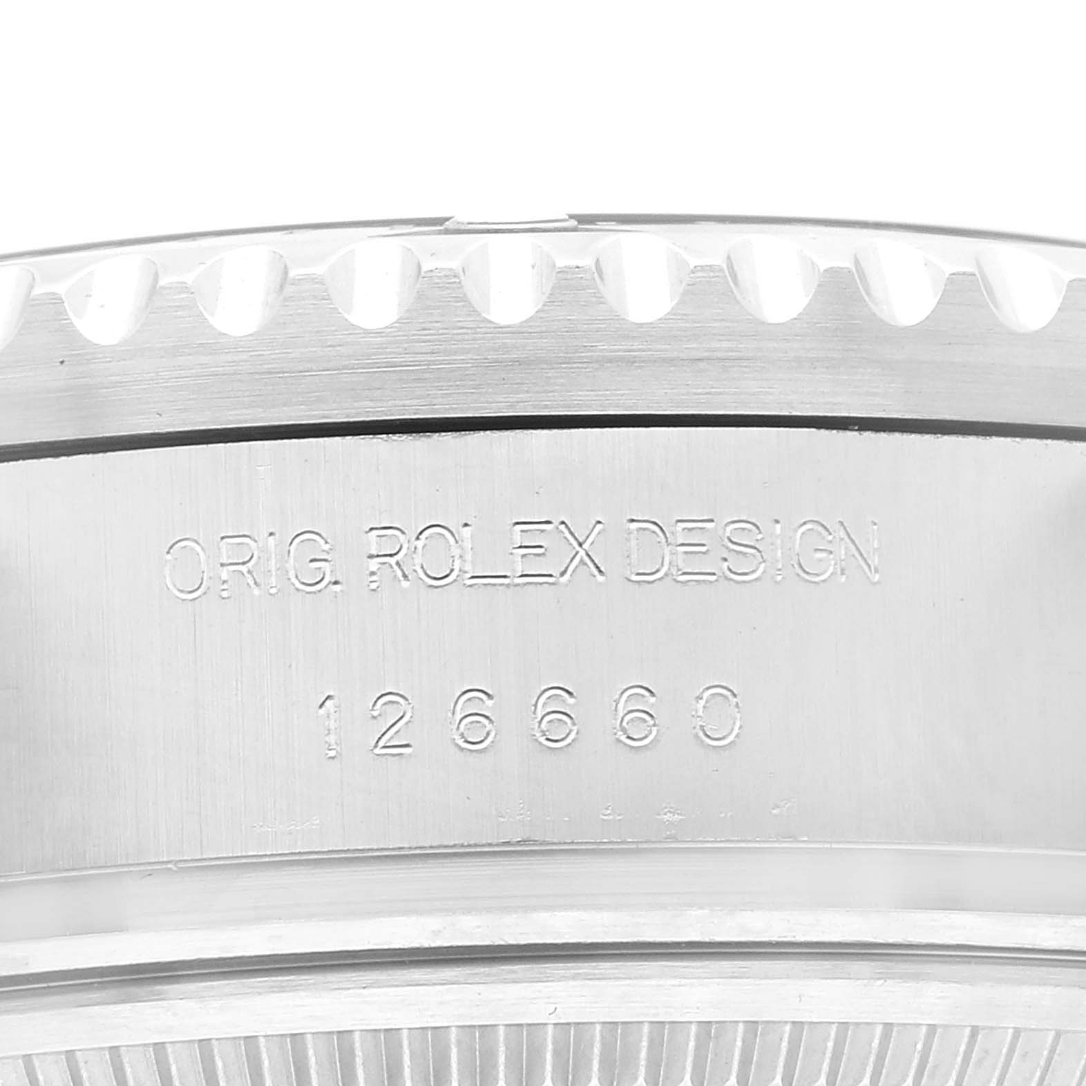 The image shows a close-up of the engraved text and model number on the side of a Rolex Sea-Dweller 126660 Men
s Stainless Steel Black Dial 126660 Men
s Stainless Steel Black Dial watch case.