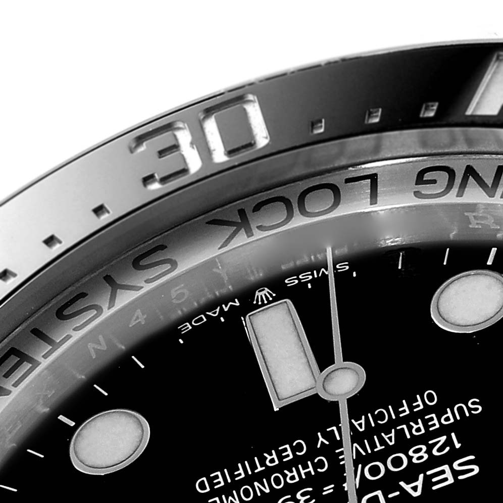This close-up of a Rolex Sea-Dweller 126660 Men
s Stainless Steel Black Dial 126660 Men
s Stainless Steel Black Dial watch shows part of the bezel, dial, and hands, with focus on the "30" marking.